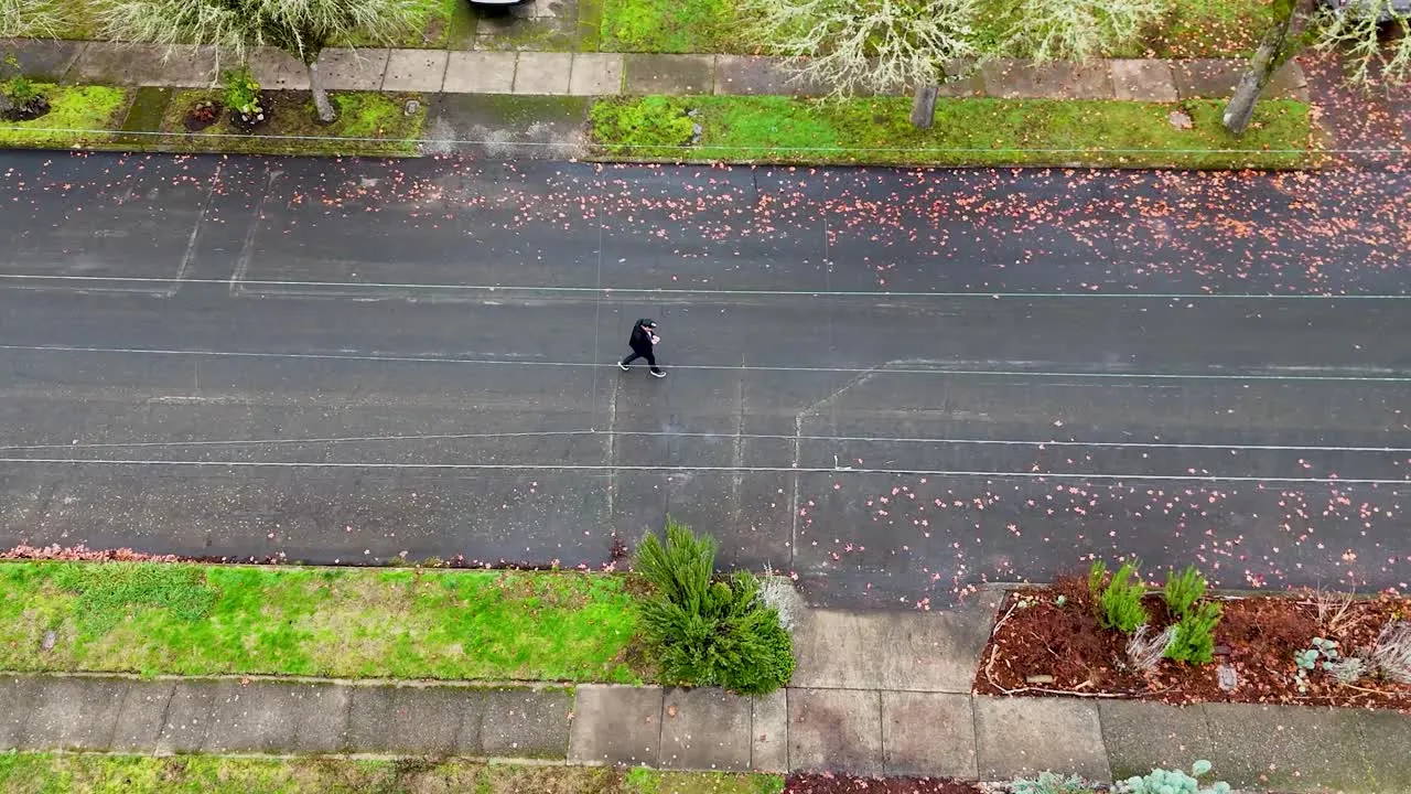 An Onyx Fiber rep walking a neighborhood street while out knocking doors
