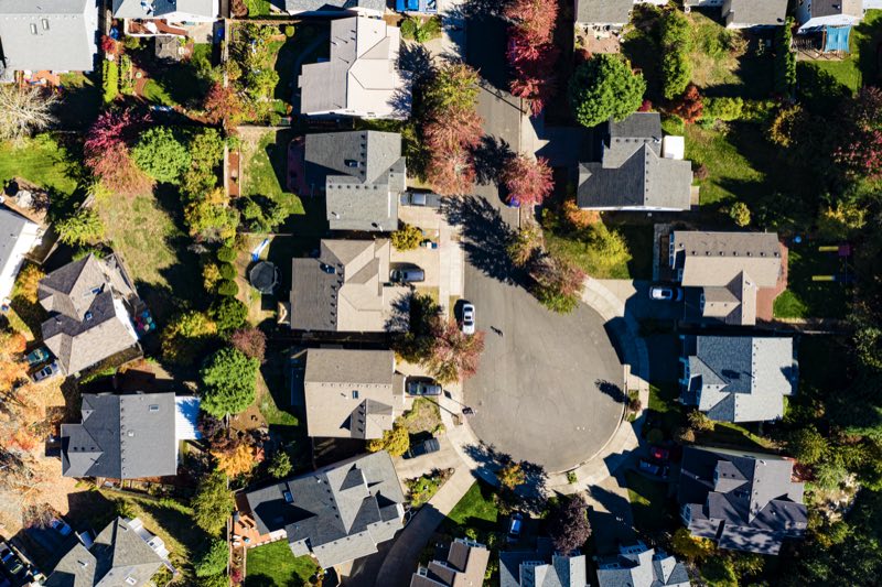 Aerial view of a suburban neighborhood street, the kind of territory reps knock door to door